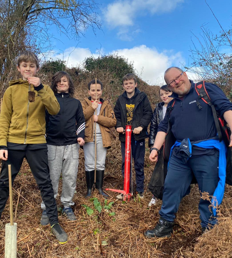 Members of the Youf Gang planting trees