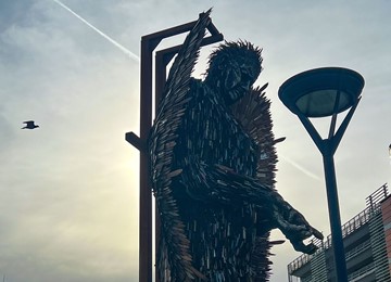 Close up on top half of knife angel
