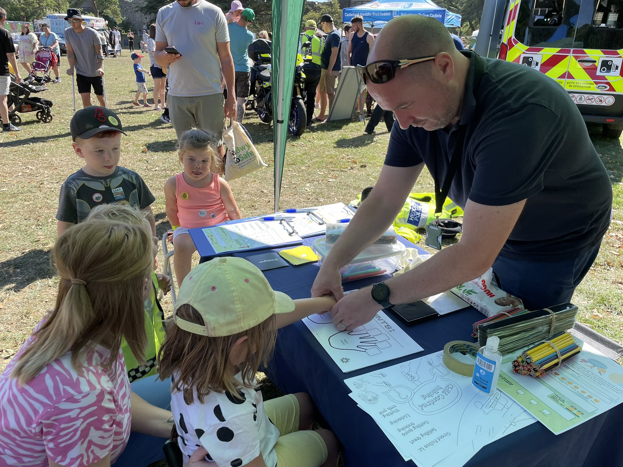 Member of the OPCC finger printing children