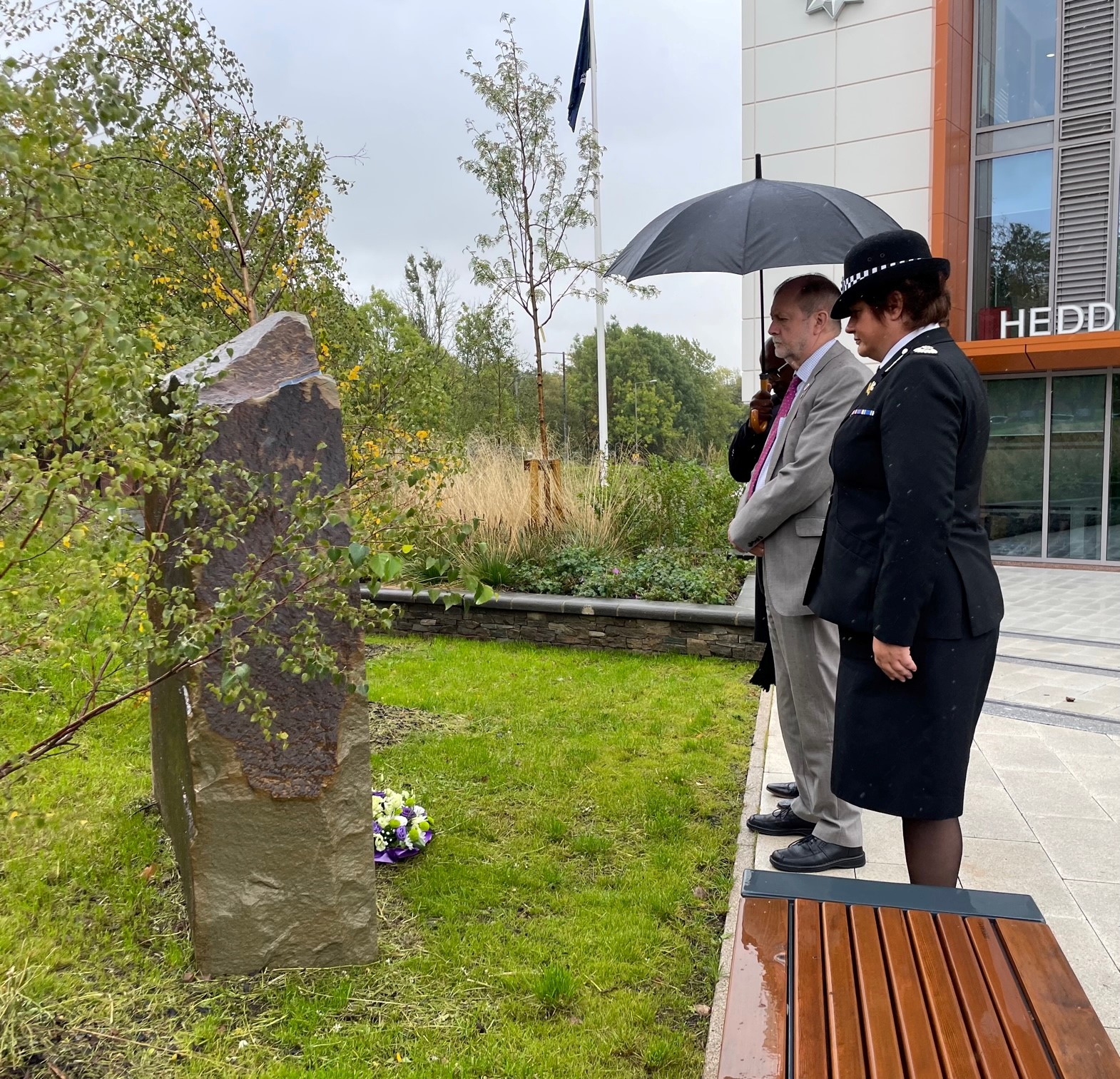 Jeff Cuthbert and Chief Constable Pam Kelly paying respects at memorial stone