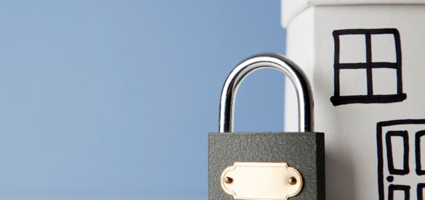 picture of padlock next to house