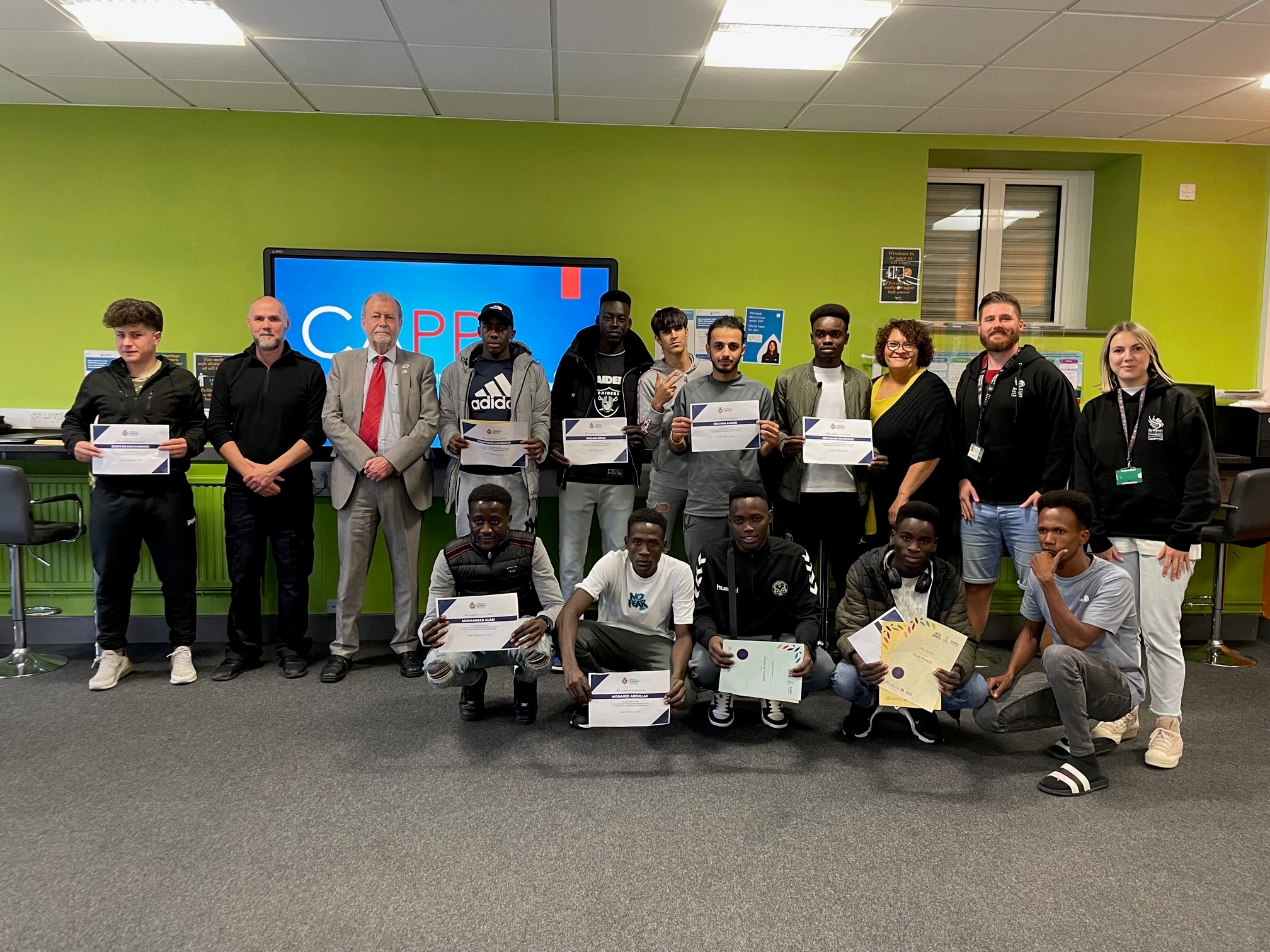 Jeff Cuthbert with children and young people who have received certificates 
