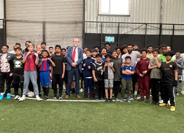 Jeff Cuthbert with children and young people from Newport Yemini Community Association football session
