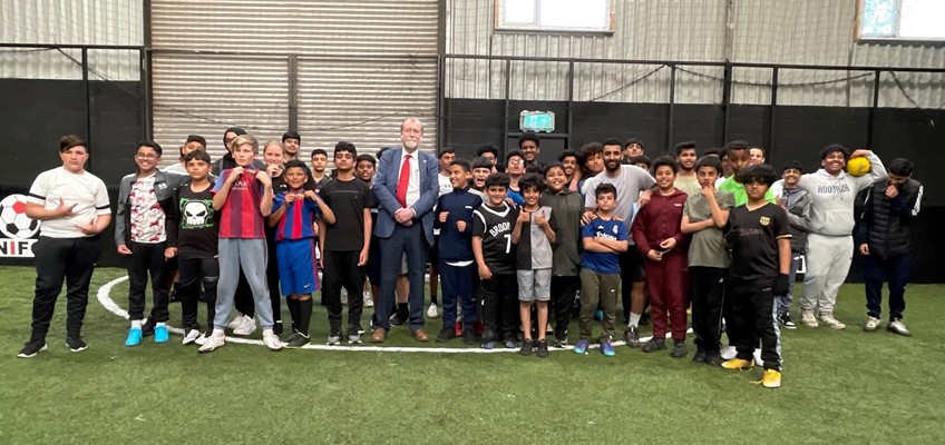 Jeff Cuthbert with children and young people from Newport Yemini Community Association football session