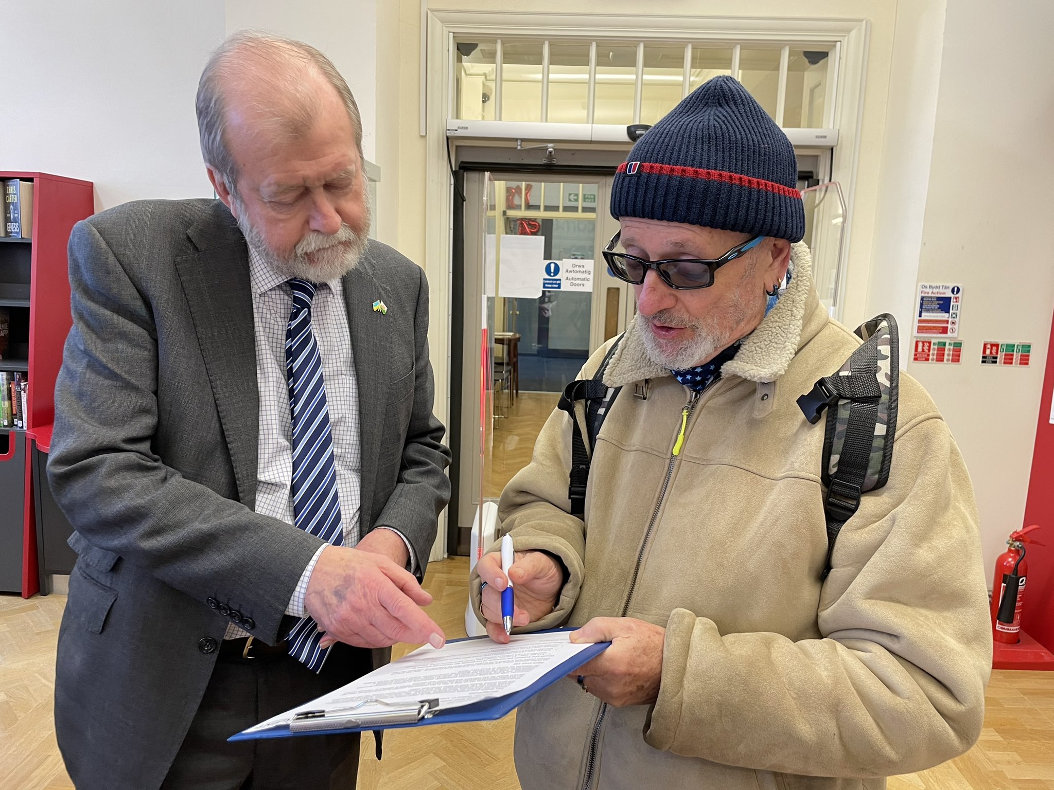 Jeff Cuthbert talking to resident