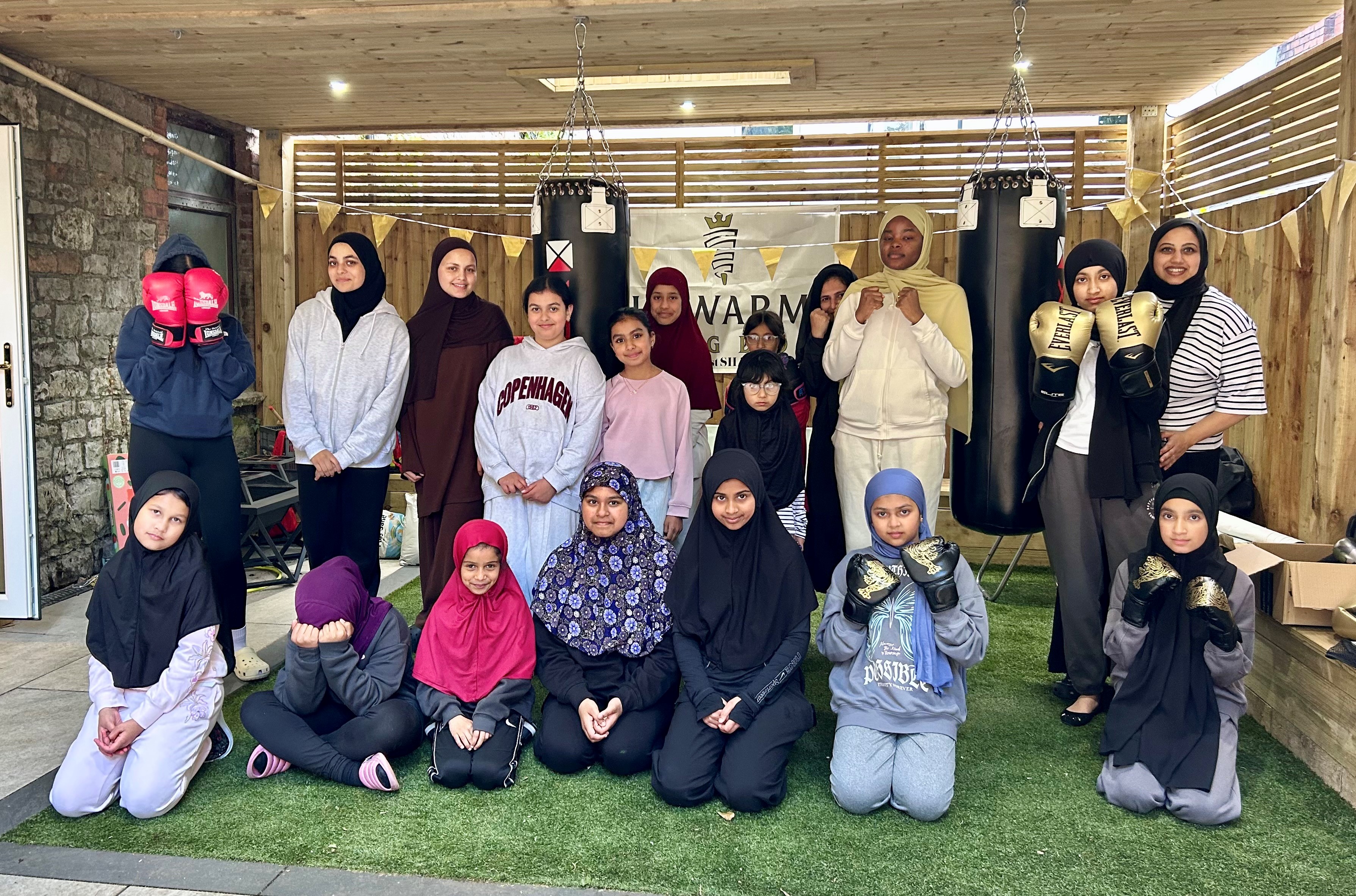 young people posing at kick boxing class