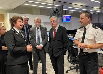 Commissioner, Chief Constable and First Minister talking to Gwent Police officers in control room