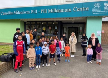 Children and staff outside Pillgwenlly Millennium Centre